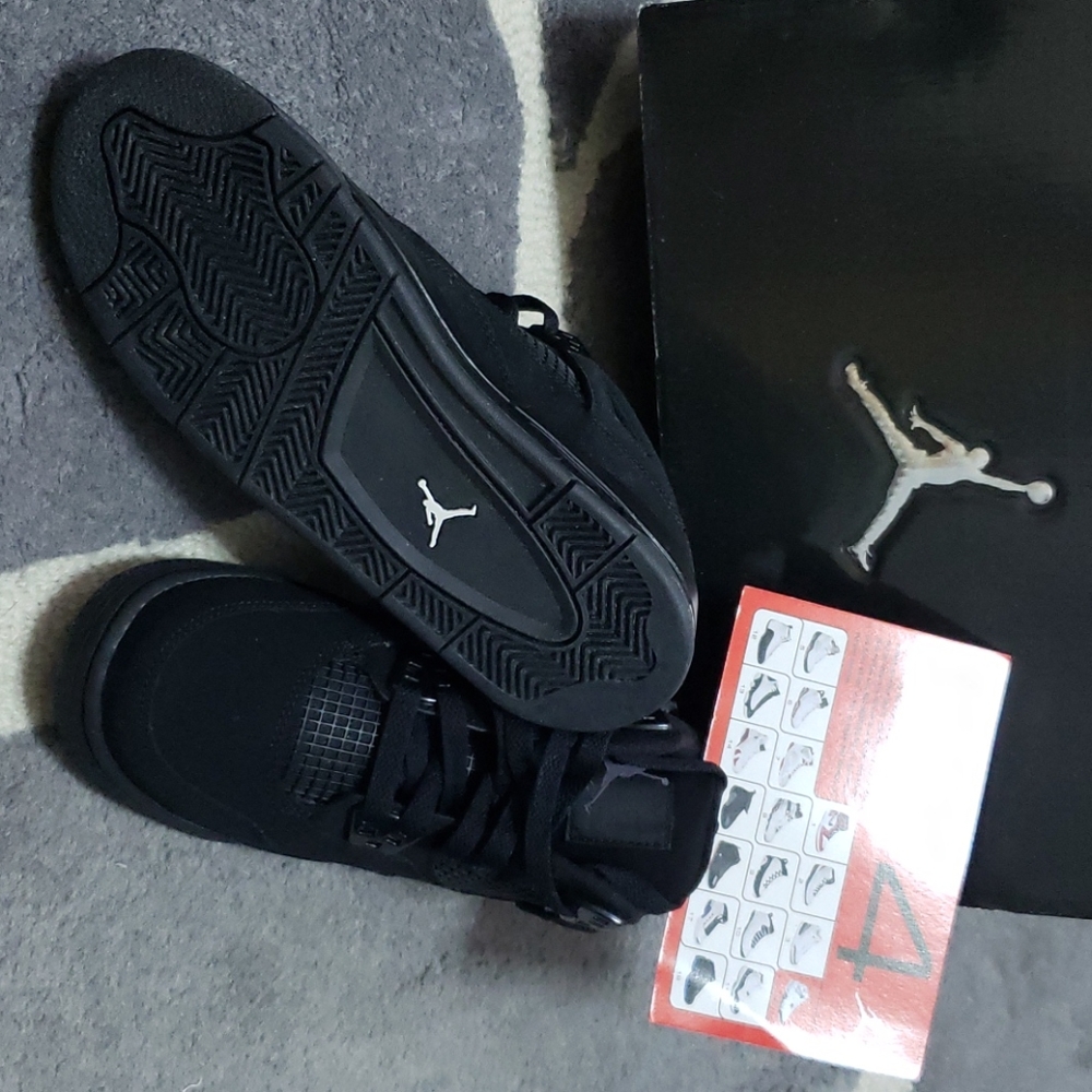 Black cat Jordan 4s